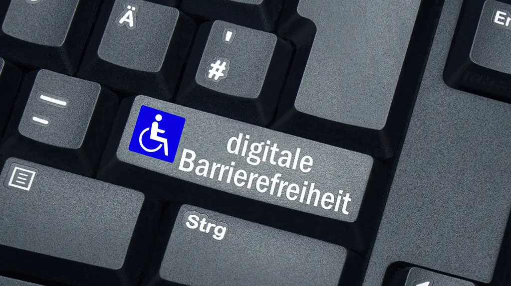 Symbolbild für digitale Barrierefreiheit: Tastatur mit Aufschrift "digitale Barrierefreiheit" und einem blauen Rollstuhl-Symbol